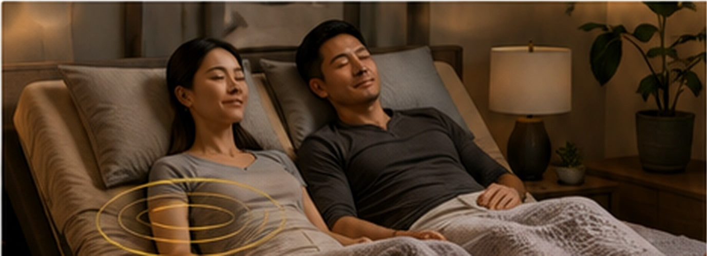 Fit couple relaxing with the massage feature on an adjustable bed